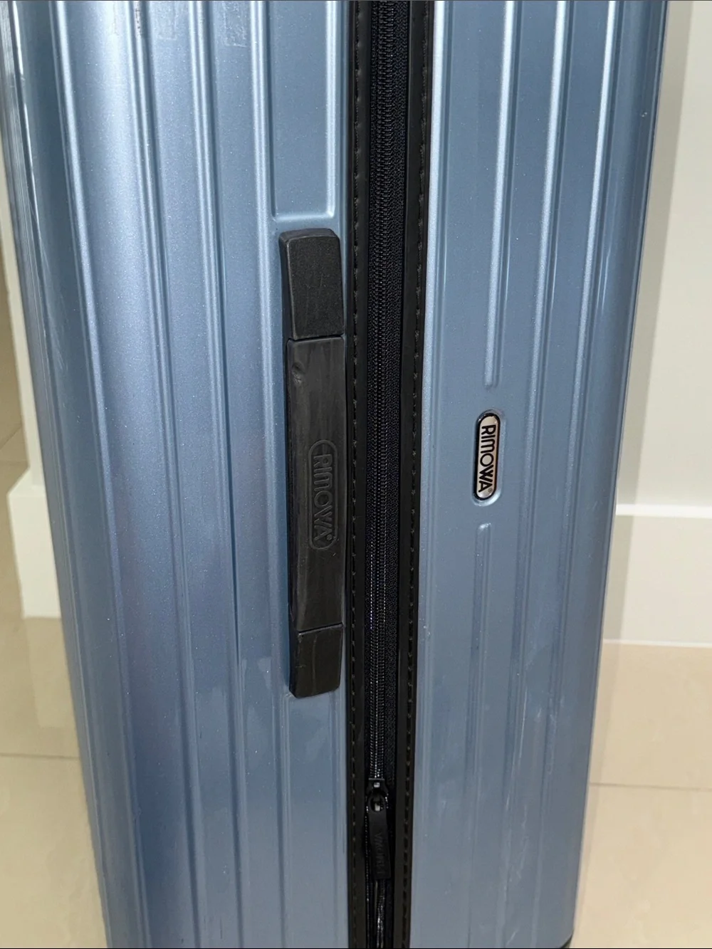 RIMOWA Salsa Air Multiwheel acrylic suitcase in Ice Blue.